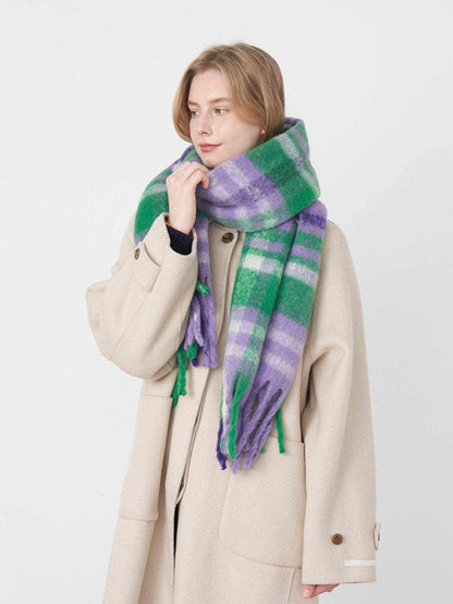 Fringe plaid polyester scarf in green and purple worn with beige coat
