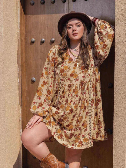 Plus size printed V-neck mini dress with balloon sleeves and ruched details