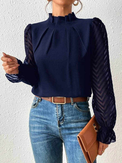 Navy mock neck blouse with ruffled flounce sleeves and semi-sheer fabric