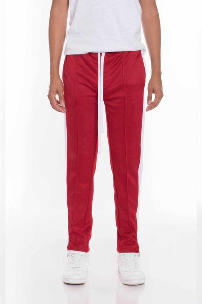 Men wearing red striped tricot tapered pants with drawstring waist and white sneakers