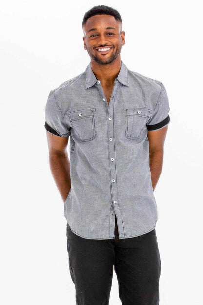 Man wearing casual short sleeve button-down solid shirt with chest pockets